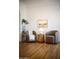 Well-lit sitting room featuring comfortable armchairs and hardwood floors at 917 W Willetta St, Phoenix, AZ 85007