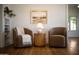 Bright sitting area featuring comfy armchairs, hardwood floors and natural light at 917 W Willetta St, Phoenix, AZ 85007