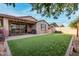 Backyard featuring a lawn, patio, barbecue, and ambient string lighting at 9831 E Tupelo Ave, Mesa, AZ 85212