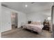 Bedroom features a bed, crib, and ensuite bathroom at 9831 E Tupelo Ave, Mesa, AZ 85212