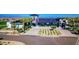 Modern clubhouse features a spacious parking lot, lush landscaping, and desert surroundings at 9831 E Tupelo Ave, Mesa, AZ 85212