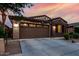 Charming single-story home with a two-car garage and well-maintained landscaping at 9831 E Tupelo Ave, Mesa, AZ 85212