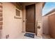 A welcoming front entry with a decorative mat and seasonal home decor sign creates a warm ambiance at 9831 E Tupelo Ave, Mesa, AZ 85212