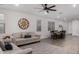 Open-concept floorplan featuring wood-look floors, comfortable seating area, and a dining space at 9831 E Tupelo Ave, Mesa, AZ 85212