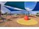 Playground with swings, climbing equipment, and soft ground covering at 9831 E Tupelo Ave, Mesa, AZ 85212