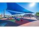 Playground with shaded seating, climbing equipment, and soft ground covering at 9831 E Tupelo Ave, Mesa, AZ 85212
