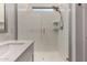 Detailed view of a glass shower with white tiled walls and modern fixtures at 9831 E Tupelo Ave, Mesa, AZ 85212