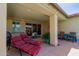 Relaxing covered back patio with lounge chairs and outdoor seating at 10310 E Tillman Ave, Mesa, AZ 85212
