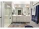 Bright bathroom with double vanity, ample counter space, and a walk-in shower at 10310 E Tillman Ave, Mesa, AZ 85212