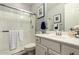 Modern bathroom with a glass-enclosed shower and a white vanity at 10310 E Tillman Ave, Mesa, AZ 85212