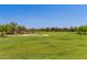 Expansive grassy community park with walking paths at 10310 E Tillman Ave, Mesa, AZ 85212