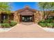 Stunning entrance featuring a brick walkway leading up to an entryway with a unique geometric pattern and well-manicured landscaping at 10310 E Tillman Ave, Mesa, AZ 85212