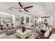 Bright and spacious living area with modern furniture, open floor plan, and easy access to the dining and kitchen areas at 10310 E Tillman Ave, Mesa, AZ 85212