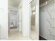 Bright bathroom space shows linen closet, vanity, and shower with tub at 1106 E Altadonna St, San Tan Valley, AZ 85140