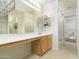Light and bright bathroom features a vanity, updated mirror, and a shower-tub combo at 1106 E Altadonna St, San Tan Valley, AZ 85140