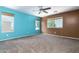 This neutral bedroom with carpet has two-tone walls and natural light at 1106 E Altadonna St, San Tan Valley, AZ 85140