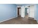 Cozy bedroom with plush carpeting, ceiling fan, closet and adjoining doors, creating a peaceful atmosphere at 1106 E Altadonna St, San Tan Valley, AZ 85140
