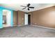 Empty bedroom has carpet flooring, closet space, and is painted with two-tone walls at 1106 E Altadonna St, San Tan Valley, AZ 85140