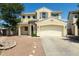 Charming two-story home features a two-car garage and stone accents at 1106 E Altadonna St, San Tan Valley, AZ 85140