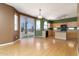 Spacious kitchen area offers wooden cabinets, stainless appliances, and backyard access at 1106 E Altadonna St, San Tan Valley, AZ 85140