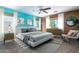 Styled bedroom with two-tone walls, ceiling fan and natural light through multiple windows at 1106 E Altadonna St, San Tan Valley, AZ 85140
