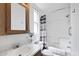 Bright bathroom featuring a white tub, updated shower, and charming wood vanity at 111 S Greenfield Rd # 190, Mesa, AZ 85206