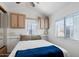 Comfortable bedroom with neutral decor, built-in cabinets and bright natural light at 111 S Greenfield Rd # 190, Mesa, AZ 85206