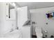 Utility room featuring a stacked washer/dryer, vanity with sink, and toilet at 111 S Greenfield Rd # 190, Mesa, AZ 85206