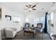 Comfortable living room filled with light from the large windows and an adjoining door to the patio at 111 S Greenfield Rd # 190, Mesa, AZ 85206