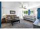 Bright and airy living room with comfortable seating and ample natural light at 111 S Greenfield Rd # 190, Mesa, AZ 85206