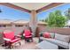 Cozy covered balcony with outdoor seating and views of the surrounding community at 11680 E Sahuaro Dr # 2011, Scottsdale, AZ 85259
