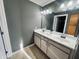Bathroom with double sink vanity, granite countertops, and ample storage space at 11680 E Sahuaro Dr # 2011, Scottsdale, AZ 85259