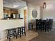 Open concept dining area and kitchen with breakfast bar and pendant lighting at 11680 E Sahuaro Dr # 2011, Scottsdale, AZ 85259