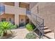 Exterior view with desert landscaping, stairs, and walkways leading to upper units at 11680 E Sahuaro Dr # 2011, Scottsdale, AZ 85259