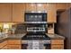 Updated kitchen with stainless steel appliances, granite counter tops, and wood cabinets at 11680 E Sahuaro Dr # 2011, Scottsdale, AZ 85259