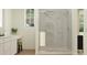 Bright bathroom with a large shower, white cabinets, and a wood floor with plenty of natural light at 11940 W Calle De Pompas --, Peoria, AZ 85383