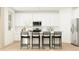 Modern kitchen featuring sleek white cabinetry, stainless steel appliances, and an island at 11940 W Calle De Pompas --, Peoria, AZ 85383
