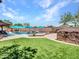 Spacious backyard with artificial turf, perfect for outdoor activities and relaxing by the pool at 12706 W Pasaro Dr, Peoria, AZ 85383