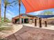 Exterior shot of community center building with palm trees and a patio area at 12706 W Pasaro Dr, Peoria, AZ 85383