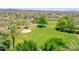 Expansive community park with lush green space, walking paths, and a playground for outdoor recreation at 12706 W Pasaro Dr, Peoria, AZ 85383