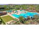 Aerial view of a community pool with a slide, shaded areas, and well-maintained landscaping at 12706 W Pasaro Dr, Peoria, AZ 85383