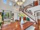 Elegant dining space featuring an expansive view of the home's open concept and grand staircase at 12706 W Pasaro Dr, Peoria, AZ 85383