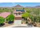 Beautiful home exterior with solar panels, a well-maintained yard, and a sparkling pool in the backyard at 12706 W Pasaro Dr, Peoria, AZ 85383