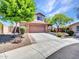 Beautiful home with a two-car garage, desert landscaping, and a covered front porch at 12706 W Pasaro Dr, Peoria, AZ 85383