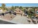 Aerial view of the home featuring a front yard with desert landscaping and a two-car garage at 13051 N 75Th Dr, Peoria, AZ 85381