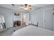 Relaxing bedroom with ceiling fan, television, and sitting area at 13051 N 75Th Dr, Peoria, AZ 85381
