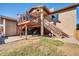 Home exterior view featuring an elevated deck, stairs, and covered storage with bike parking at 13051 N 75Th Dr, Peoria, AZ 85381