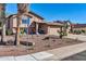 Inviting home with desert landscaping, two-car garage and a cozy front porch area at 13051 N 75Th Dr, Peoria, AZ 85381