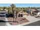 Charming single-Gathering home featuring mature palm trees and a desert landscaped front yard and a spacious driveway at 13051 N 75Th Dr, Peoria, AZ 85381