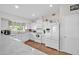 Well-lit kitchen featuring white appliances, ample counter space, and tiled floors at 13051 N 75Th Dr, Peoria, AZ 85381